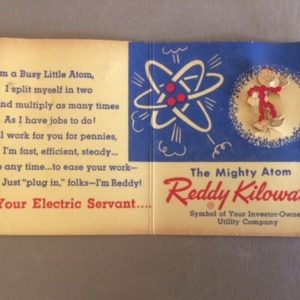 Reddy Kilowatt pin on original card
