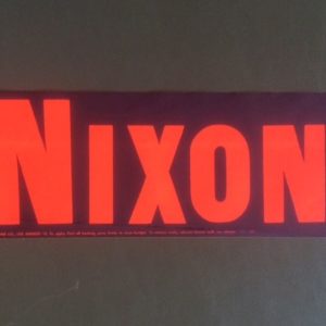 Nixon small red and black bumper sticker.